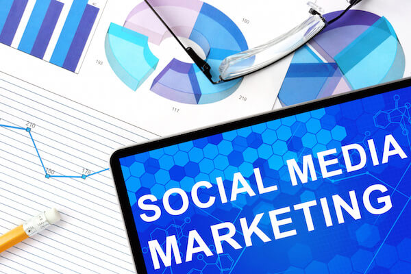 Tablet and social media marketing graphs, social media marketing